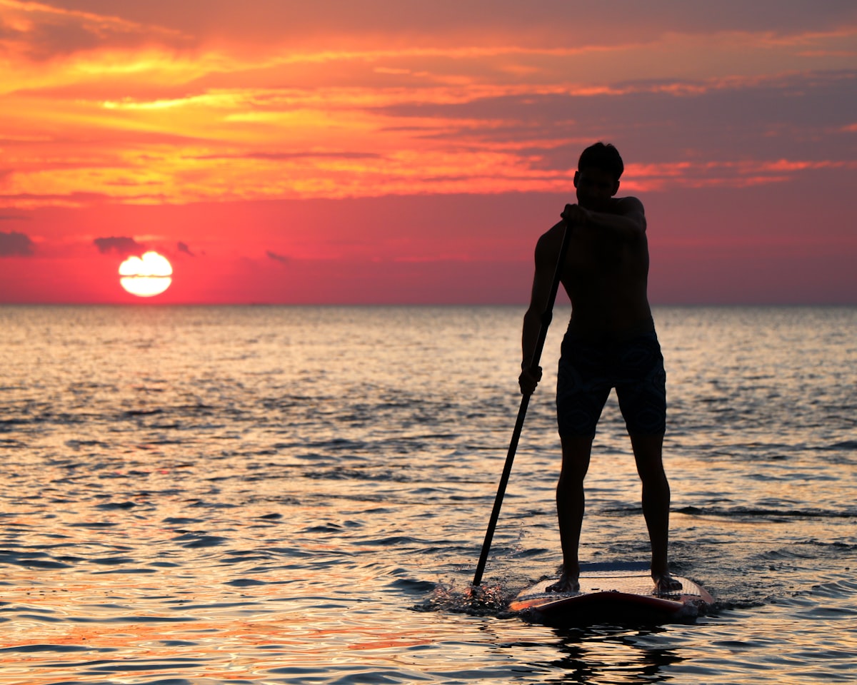 Stand-up paddleboarding on calm water