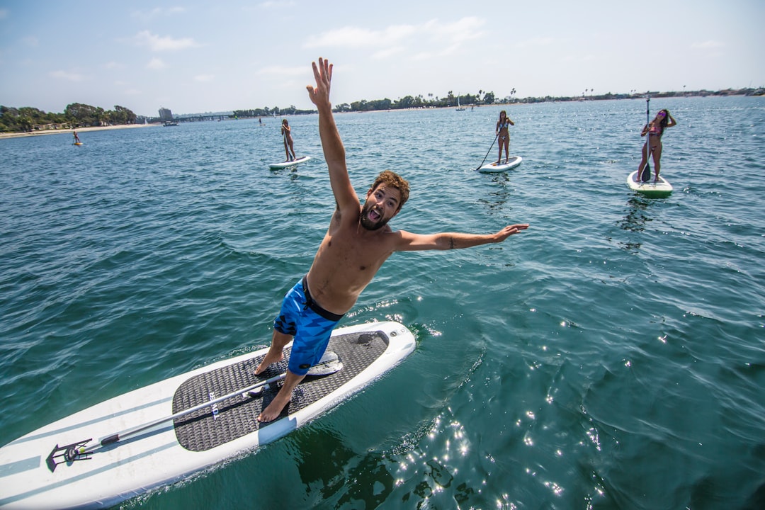 falling off paddle board water
